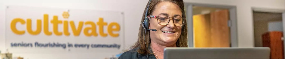 smiling service agent talking on the phone
